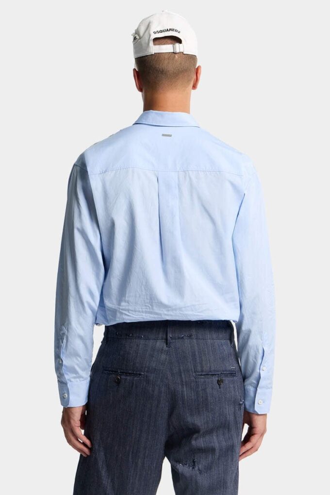 Camicia con spalle scese e taglio grezzo Camicia con spalle scese e taglio grezzo