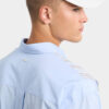 Camicia con spalle scese e taglio grezzo Camicia con spalle scese e taglio grezzo