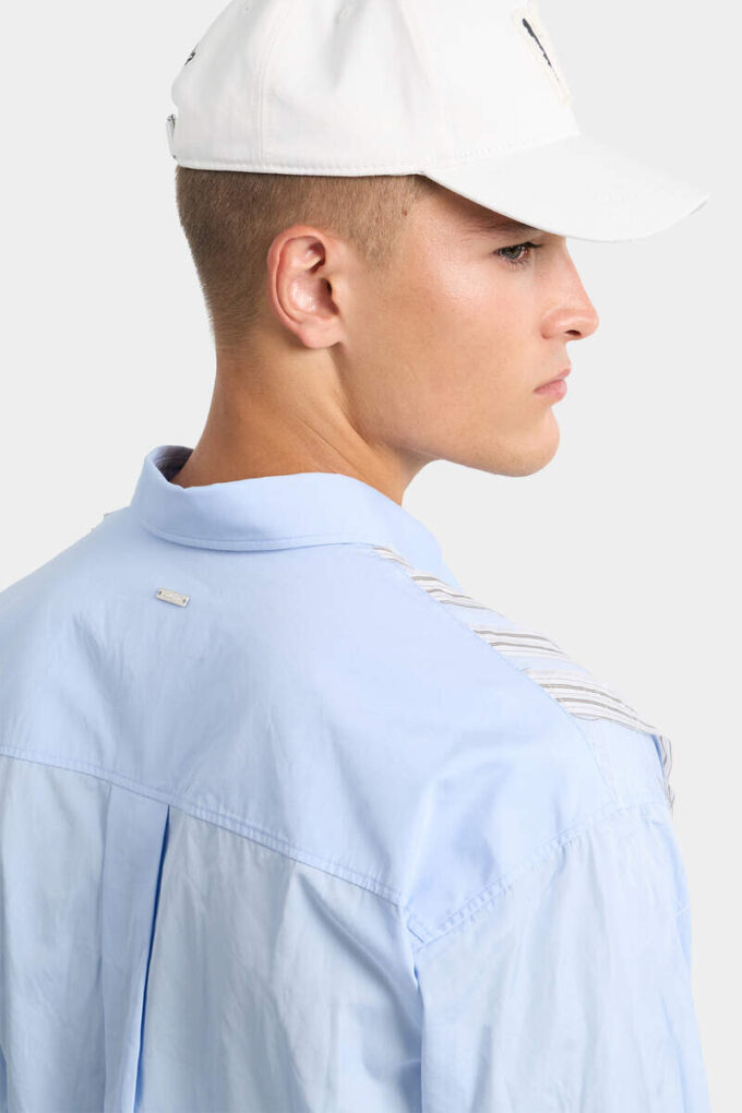 Camicia con spalle scese e taglio grezzo Camicia con spalle scese e taglio grezzo