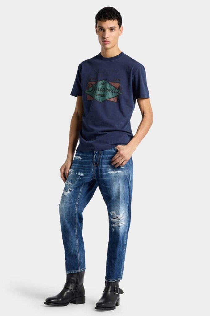 Jeans blu strappati con lavaggio medio
