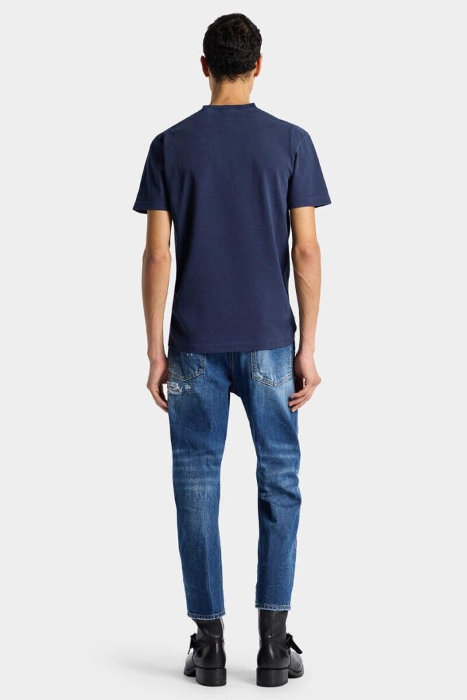 Jeans blu strappati con lavaggio medio