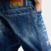 Jeans blu strappati con lavaggio medio