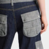 Jeans larghi con effetto intrecciato e lavaggio scuro Jeans larghi con effetto intrecciato e lavaggio scuro